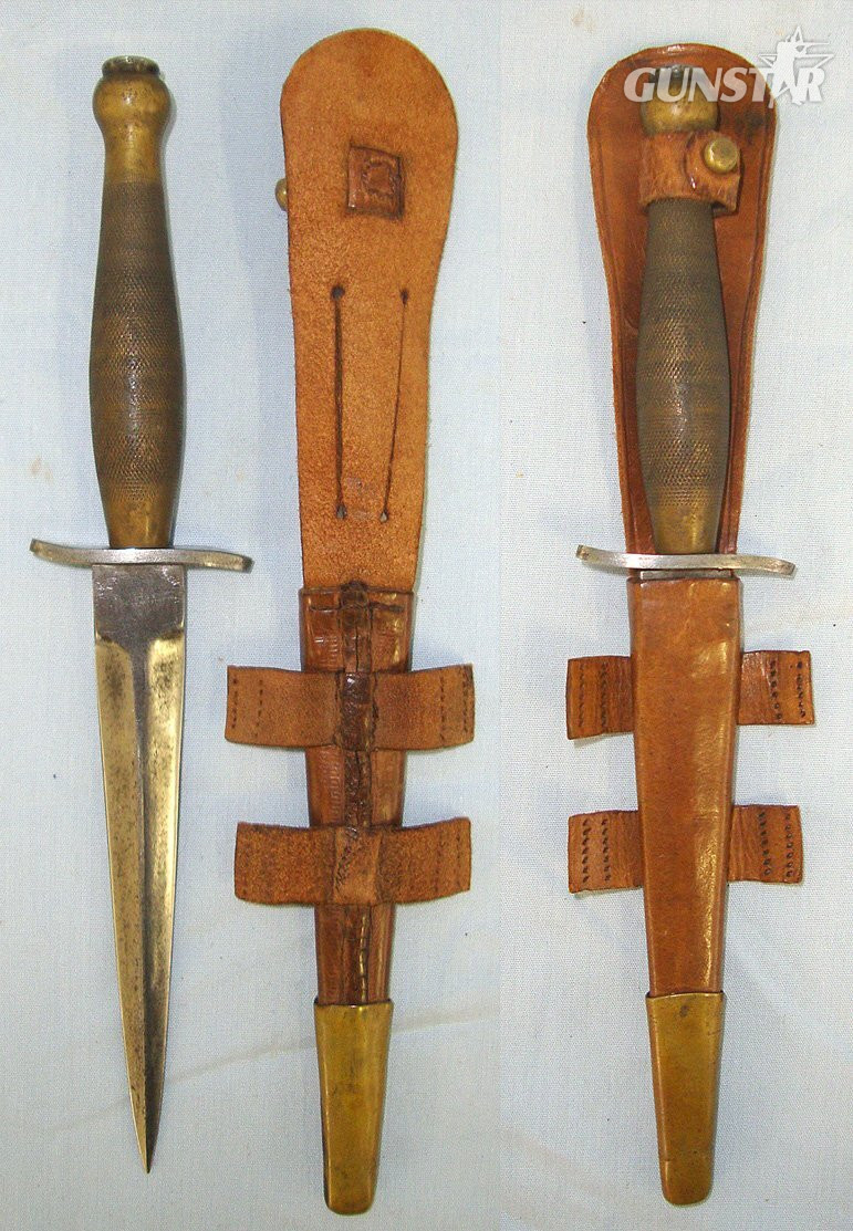  EXTREMELY RARE**POSSIBLY UNIQUE WILKINSON COLLECTION EXHIBITION PIECE**Miniature British 1st Pattern Type FS Commando Fighting Knife With Etched Panel Blade, Scabbard & Bonhams Auction Catalogue Dated 11/4/2006 In Which The Knife Featured & Was Sold. Sn 2 Knive