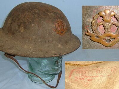 WW1 C1915 British Middlesex Regiment Officer’s 1st Pattern 1st Type Brodie \'Raw Edge\' Combat Helmet Mounted With Original Period Middlesex Regiment Cap Badge Complete With Brodie Red Ink Stamped Oil Cloth Liner, & Leather Chin Strap. Sn 22441:19  Clothing