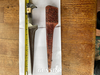 TRADITIONAL PASHTUN TRIBUTE KNIFE    YAK HORN AND BONE HANDLE    SILVER GUARD AND BUCKLE  TYPICAL T-SHAPED BLADE   TOTAL LENGTH: 35 CM  TRADITIONAL METAL AND LEATHER SHEATH Dagger