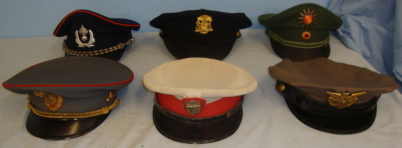 A grouping of World Police caps (Price per cap). HE 821. A grouping of World Police caps (Price per cap). HE 821. Clothing