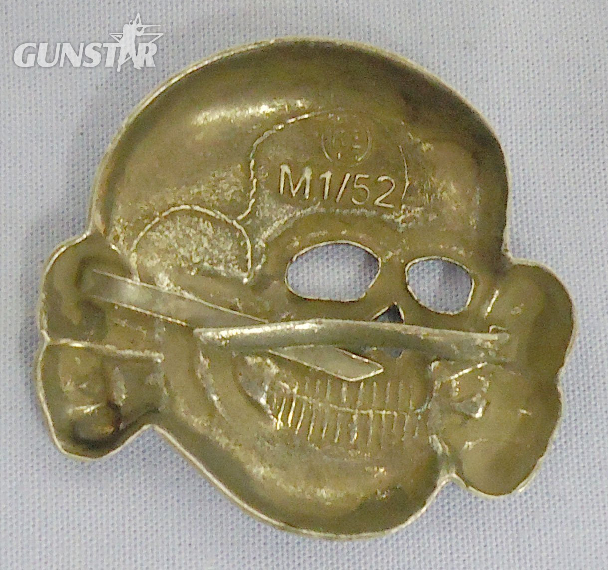  Original WWII German M1/52 SS Visor Cap Skull by Deschler & Sohn, Munich. N 114. Original WWII German M1/52 SS Visor Cap Skull by Deschler & Sohn, Munich. N 114.  Antique & Militaria