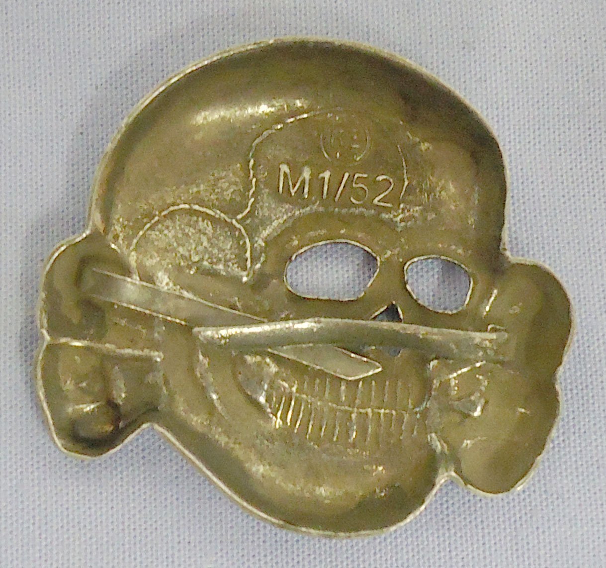  Original WWII German M1/52 SS Visor Cap Skull by Deschler & Sohn, Munich. N 114. Original WWII German M1/52 SS Visor Cap Skull by Deschler & Sohn, Munich. N 114.  Antique & Militaria