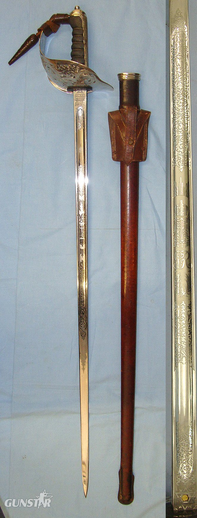 WW1 Era British WD 1897 Pattern Henry Wilkinson London Infantry Officer’s Sword With King George V Guard, Etched Blade Number 45529, Leather Officer’s Cord & Acorn Knot Leather Covered Field Service Scabbard & Sam Browne Leather Frog Without Long Stra Sword in 