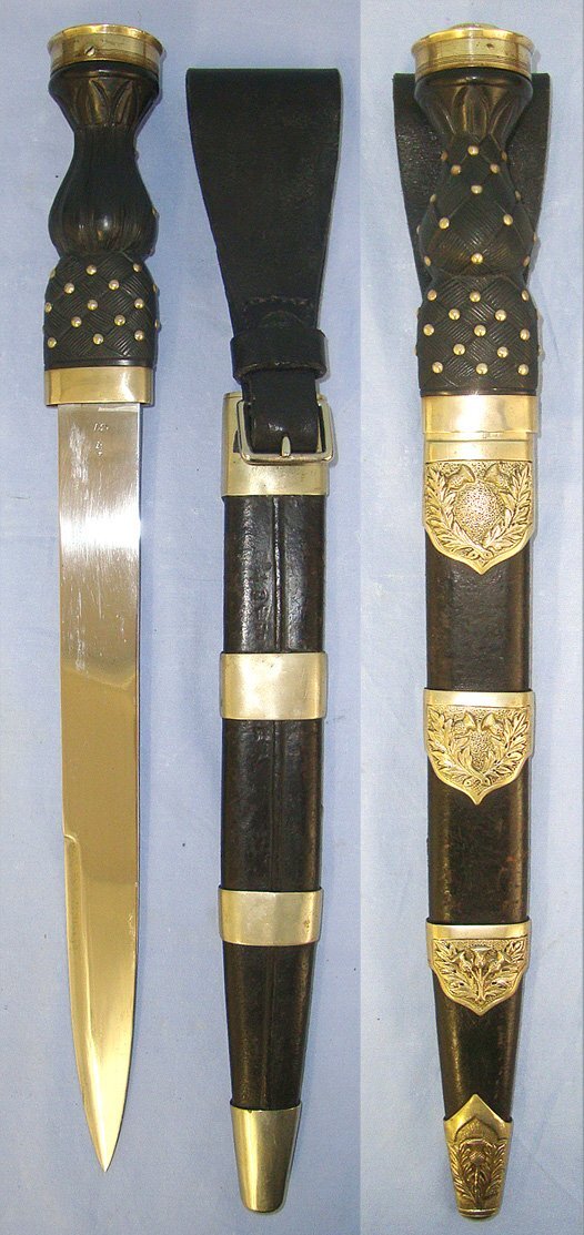  LARGE**Inter War 1937 Wilkinson Sword Pall Mall (London) British WD Scottish Highland Regiments Other Ranks German Silver Mounted Dirk With King’s Crown Pommel Cap & WD Scabbard With Leather Belt Hanger. Sn 23484:111 Knive
