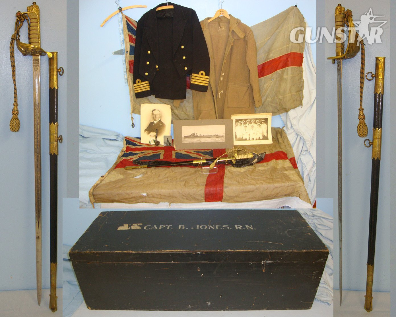 WW2 Era British Royal Navy Locker To Capt Jones DSO DSC HMS Walpole Containing A Collection Of Uniform, Dress Sword With Scabbard & Foul Weather Cover, 2 Large Ensign Flags & Ephemera. Sn 19345  Sword in 