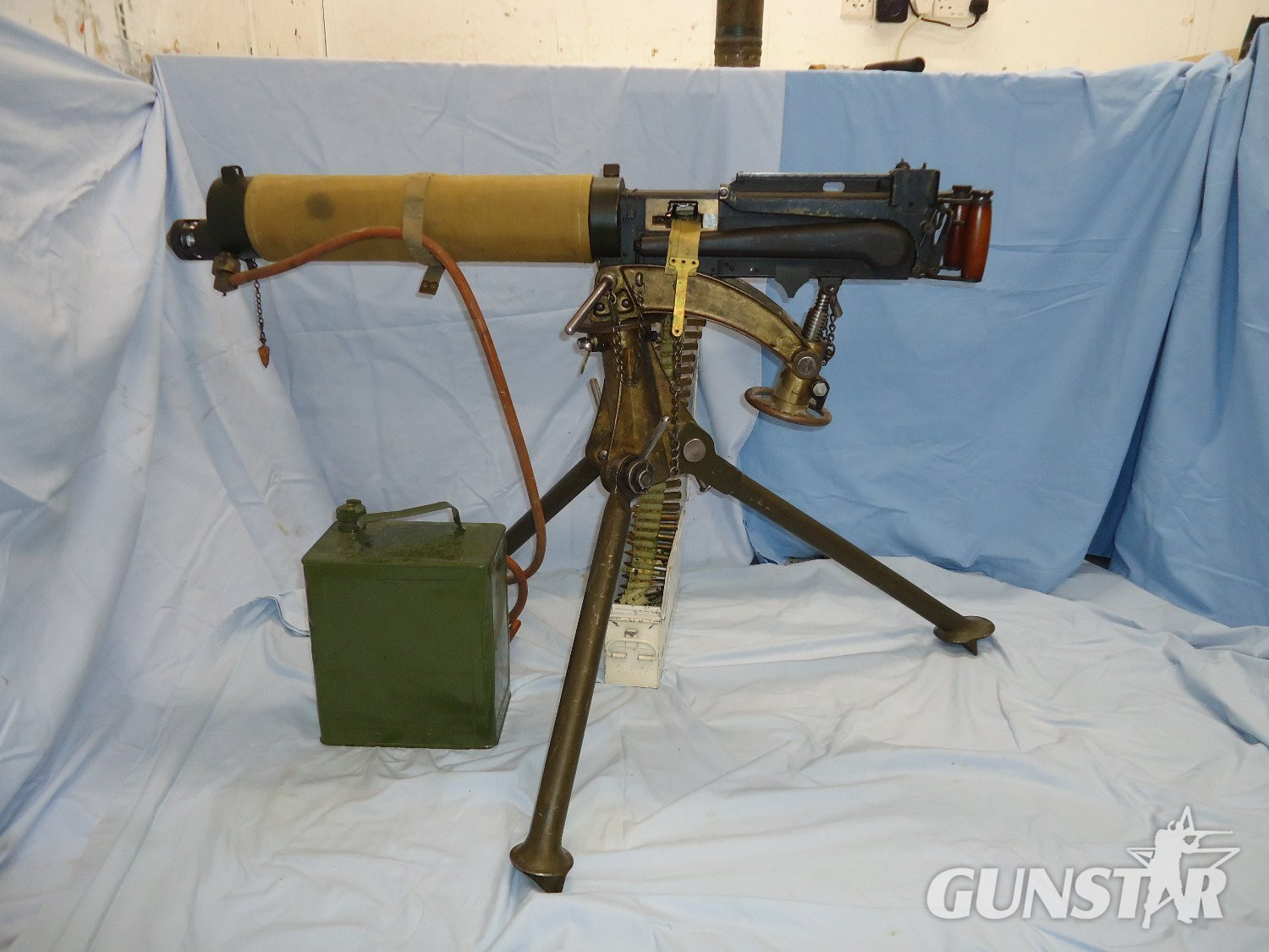 Vickers .303 Calibre Heavy Machine Gun, Linlithgow Manufacture in 1944, MK IV Cradle/Pintle By RH & S, Tripod, Condenser Tin. Condenser Adaptor, Hose, Ammunition Tin and Inert rounds in a Webbing Belt & Wooden Transit Boxes. **EARLY UK 1995 DEACTIVATION C Vickers .303 Calibre Heavy Machine Gun, Linlithgow Manufacture in 1944, MK IV Cradle/Pintle By RH & S, Tripod, Condenser Tin. Condenser Adaptor, Hose, Ammunition Tin and Inert rounds in a Webbing Belt & Wooden Transit Boxes. **EARLY UK 1995 DEACTIVATION C Various  Machine Gun - {CATEGORY}