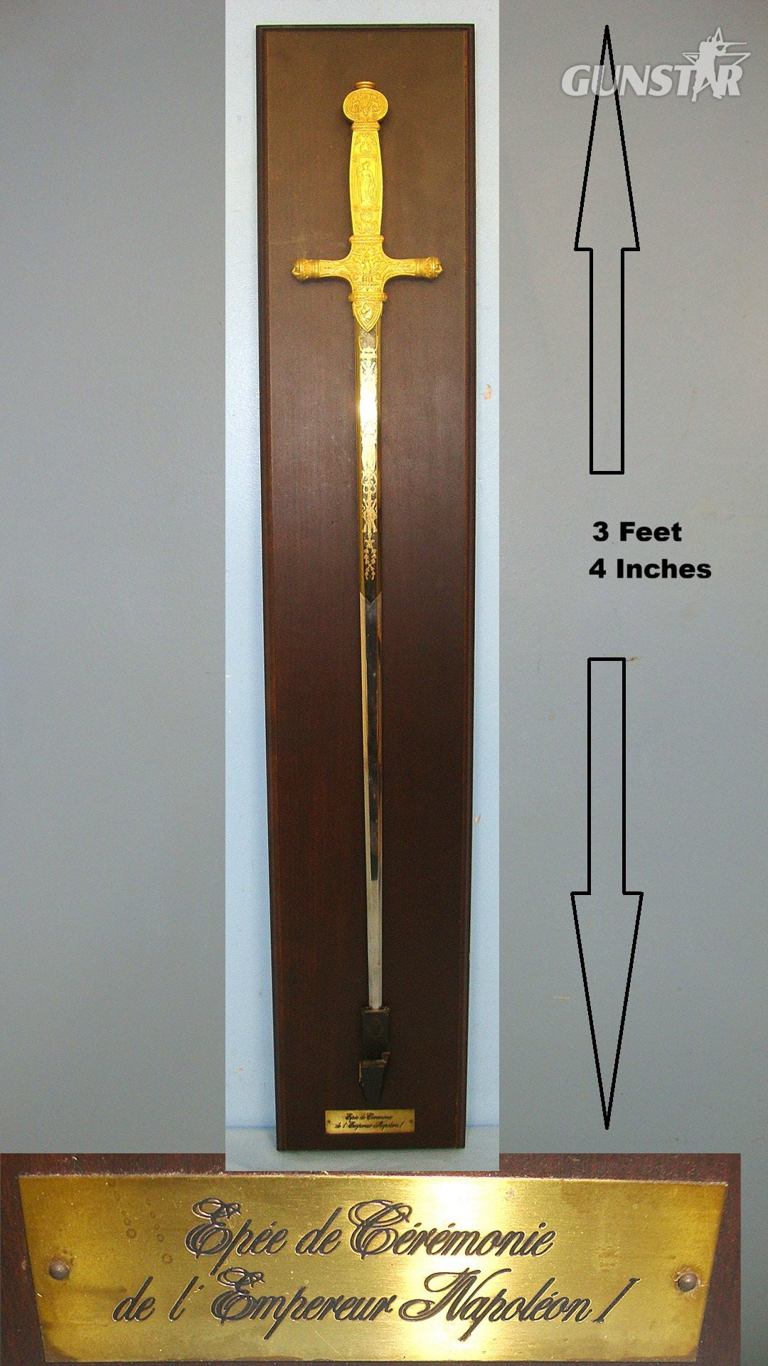 Commemorative Full Size Reproduction Of French Emperor Napoleon I’s Ceremonial Sword With Ornate Cast Hilt, Blued & Gilt Panels Etched Blade Mounted On Wooden Display Board With Identification Plaque. Sn 23306 Sword in 