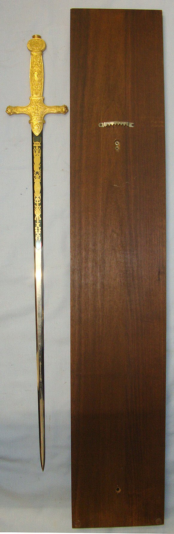  Commemorative Full Size Reproduction Of French Emperor Napoleon I’s Ceremonial Sword With Ornate Cast Hilt, Blued & Gilt Panels Etched Blade Mounted On Wooden Display Board With Identification Plaque. Sn 23306 Sword