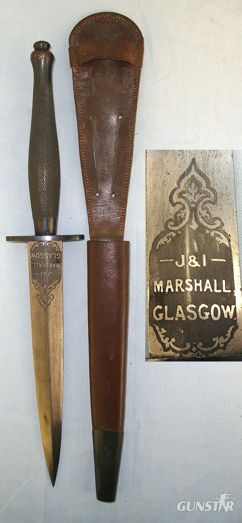 ONE OF THE RAREST**WW2 British 2nd Pattern Fairbairn Sykes FS Commando Fighting Knife By Wilkinson Retailed By J & I Marshall Glasgow Scotland With Etched Panel And Hand Drawn Blade Complete With Scabbard. Sn 23579 Knive in 