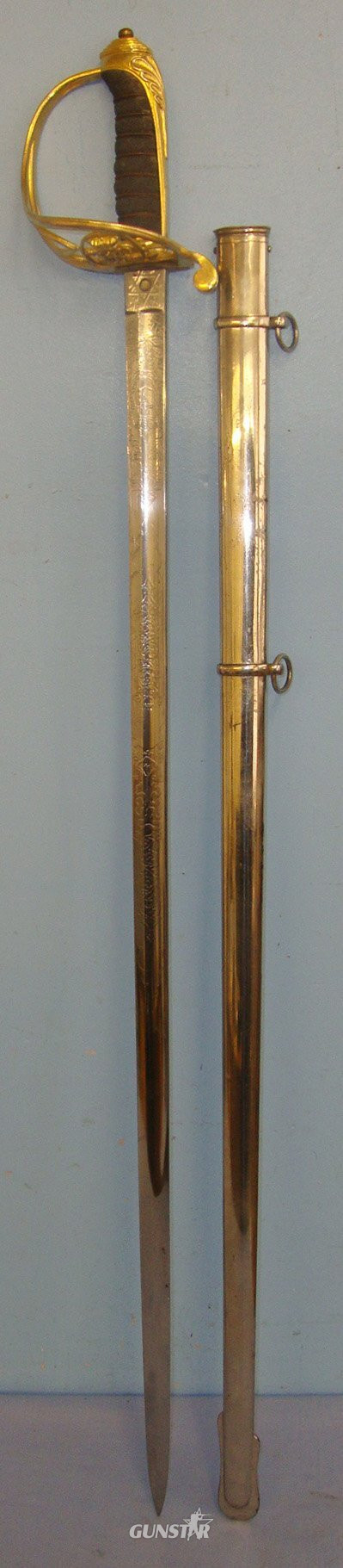  Victorian British Firmin & Sons London 1822 Pattern Infantry Officer’s Sword With Gilt Brass Guard Etched Blade To The 1st Manchester (Volunteer) Rifles & Steel Scabbard. Sn 22090 Sword