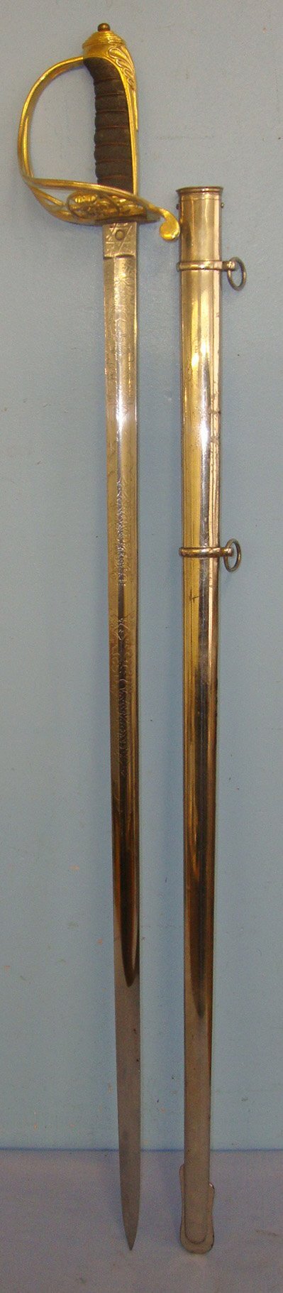  Victorian British Firmin & Sons London 1822 Pattern Infantry Officer’s Sword With Gilt Brass Guard Etched Blade To The 1st Manchester (Volunteer) Rifles & Steel Scabbard. Sn 22090 Sword