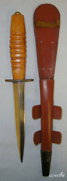 ISSUED BUT UN-USED**WW2 Wood Hilt Fairbairn Sykes, FS Far East Operations Commando & RAF Fighting Knife With ‘X7’ Marked Cross Guard & Scabbard Knive in 