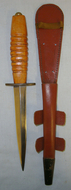 ISSUED BUT UN-USED**WW2 Wood Hilt Fairbairn Sykes, FS Far East Operations Commando & RAF Fighting Knife With ‘X7’ Marked Cross Guard & Scabbard Knive