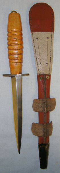  ISSUED BUT UN-USED**WW2 Wood Hilt Fairbairn Sykes, FS Far East Operations Commando & RAF Fighting Knife With ‘X7’ Marked Cross Guard & Scabbard Knive