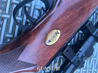 Norica Norica .22 break-barrel air rifle with hardwood stock and telescopic sight. Good overall condition with only minor cosmetic marks from normal use. Fitted with fiber-optic open sights and scope. Cocks and fires correctly. Ideal for target shooting and pest .22