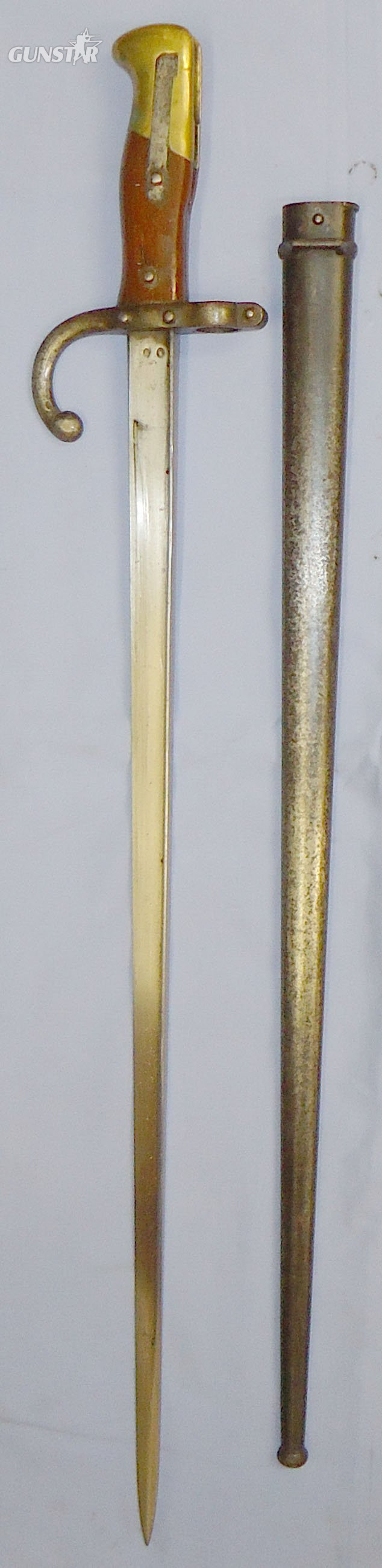 French Model 1874 Gras Sword Bayonet, 1877 Dated, by Manufactures D’Armes De St. Étienne with Scabbard. BAYO 467. Bayonet in 