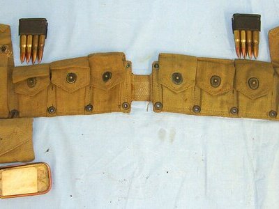 WW2 1942 U.S. Army Model 1923 M1 Garand .30 Calibre, Semi Automatic Rifle Ammunition Belt For 10 Garand Rifle Ammunition Clips By Hinson Mfg Co Containing 4 Original Ammunition Clips & Inert Deactivated Rounds  and 1942 Pouch With Fist Aid Tin. sn 23334:1 Care & Storage