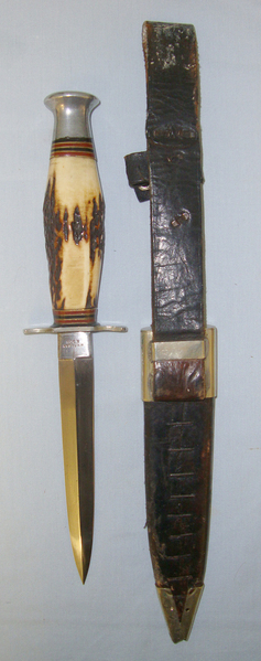  WW2 British Soldier’s Private Purchase W.H Fagan & Son Sheffield Fairbairn Sykes F.S. Style Fighting Knife/Dagger & Period Adapted Victorian Scabbard Mounted With Middlesex Regiment Brass & Enamel Badge. Dagger