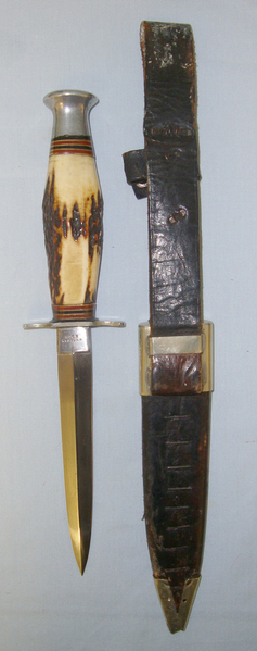  WW2 British Soldier’s Private Purchase W.H Fagan & Son Sheffield Fairbairn Sykes F.S. Style Fighting Knife/Dagger & Period Adapted Victorian Scabbard Mounted With Middlesex Regiment Brass & Enamel Badge. Dagger
