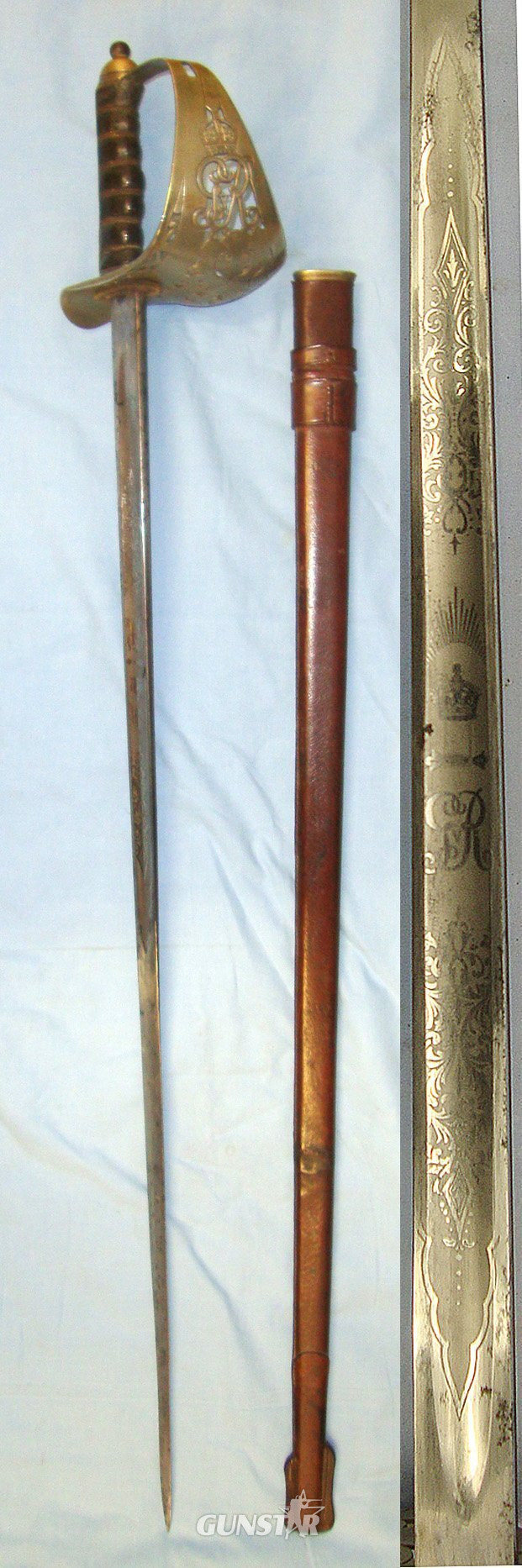  WW1 Era British 1897 Pattern Infantry Officer’s Presentation Sword With King George V Guard Inscribed ‘Presented to Lieut T G Perry by the students of Sir John Deans Grammar School Northwich, Nov 23 1914’ & Leather Covered Field Service Scabbard. ED Sword