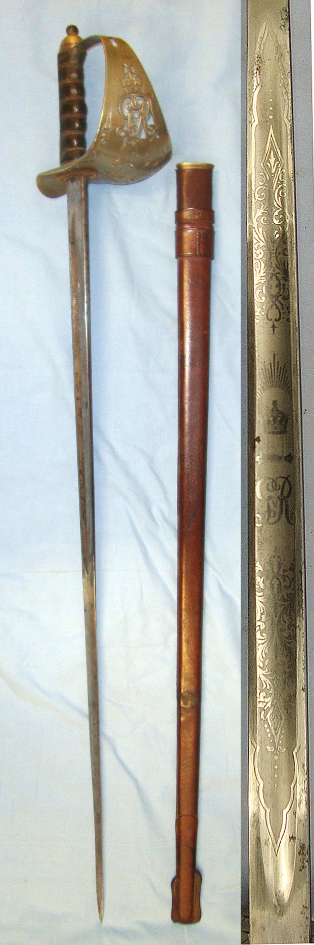  WW1 Era British 1897 Pattern Infantry Officer’s Presentation Sword With King George V Guard Inscribed ‘Presented to Lieut T G Perry by the students of Sir John Deans Grammar School Northwich, Nov 23 1914’ & Leather Covered Field Service Scabbard. ED Sword